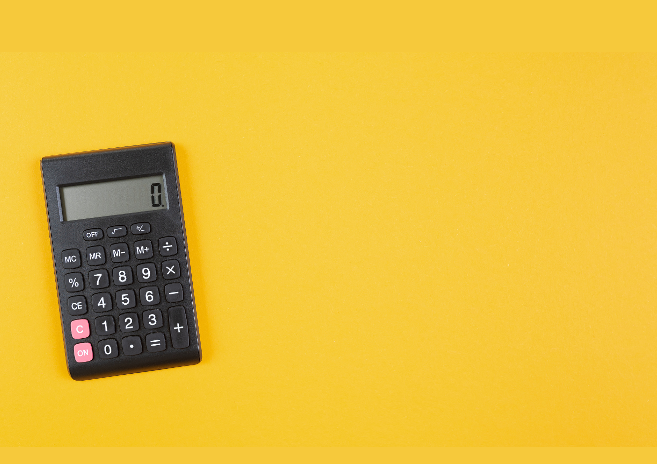 Black calculator on a yellow background.