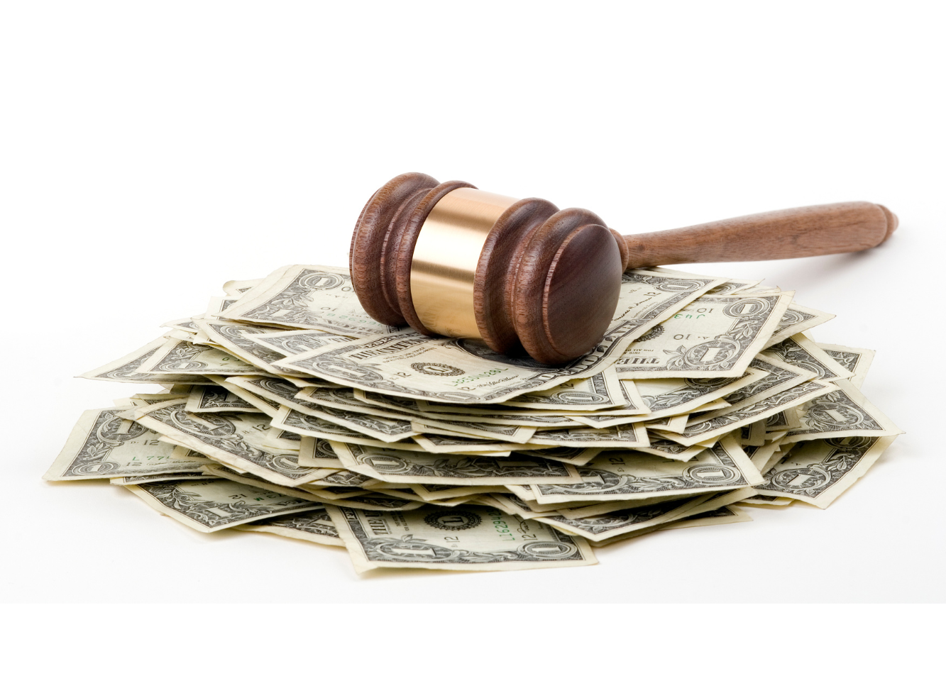 A wooden judge's gavel resting on a pile of U.S. dollar bills.