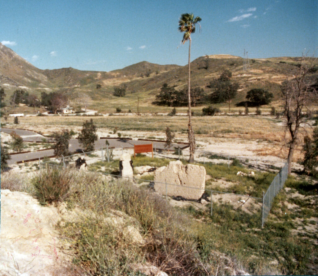 Color photograph of Tapo Adobe Ruins in the 1970s, with landscape and partial adobe walls.